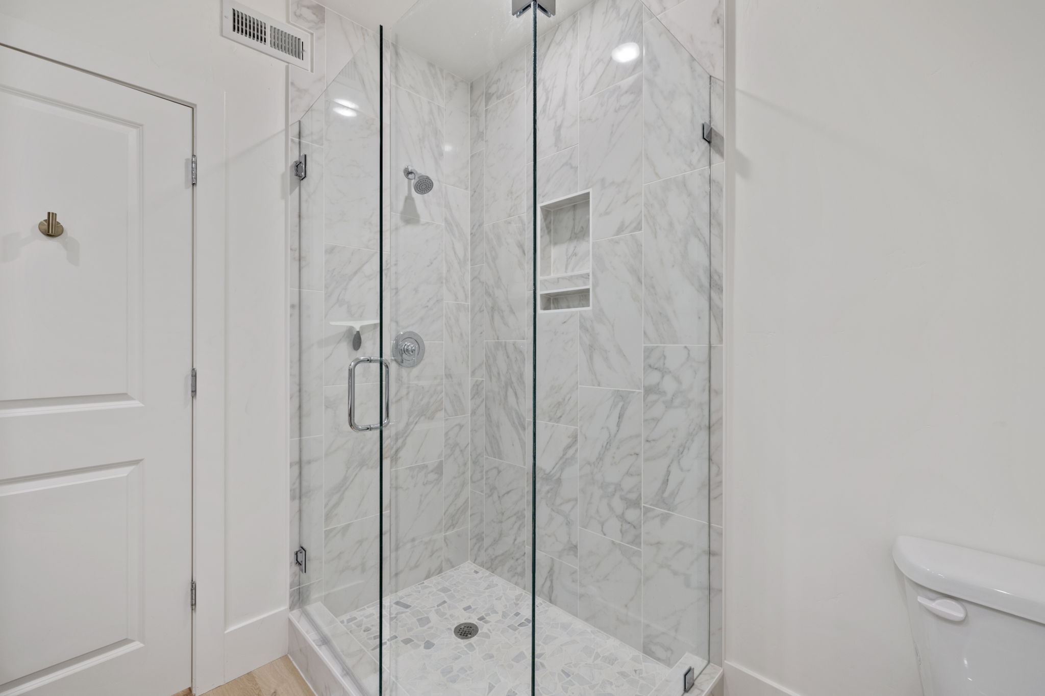 Luxury walk-in shower with marble tile