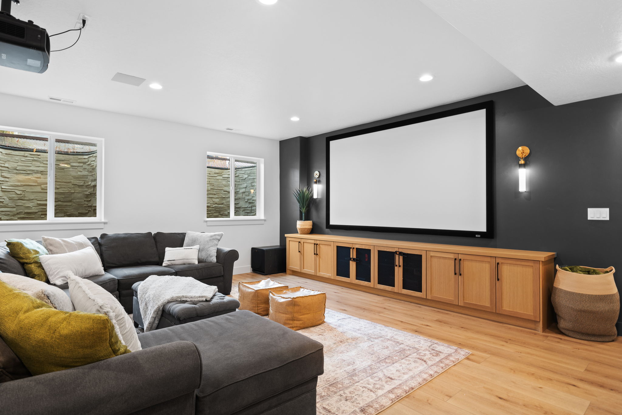 Custom home theater with projector and sectional seating